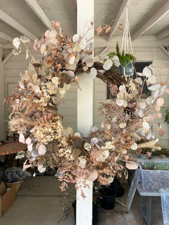 A large dried eucalyptus and fern wreath